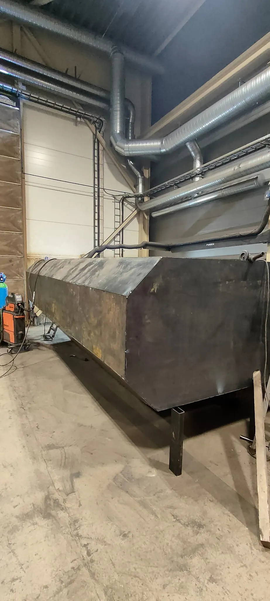 Heavy-duty dust suppression tank fabricated for a Komatsu quarry dump truck